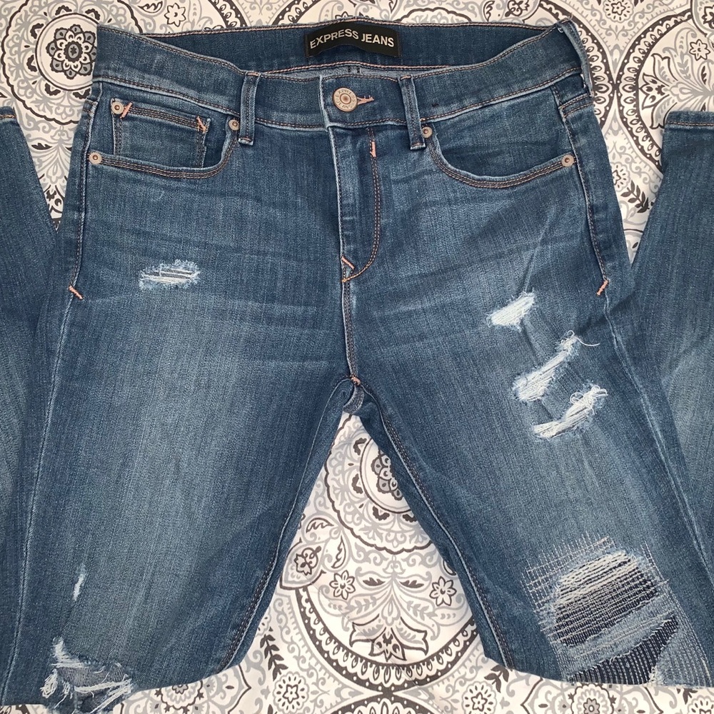 Distressed Mid Rise Legging Jeans
